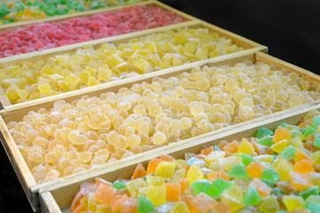 Sweet fresh colorful fruit candy at the confectionery factory ready for sale