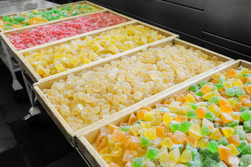 Sweet fresh colorful fruit candy at the confectionery factory ready for sale