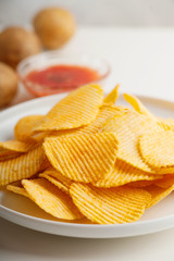 Crispy potato chips, potato and sauce 