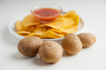 Crispy potato chips, potato and sauce 