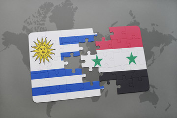 puzzle with the national flag of uruguay and syria on a world map