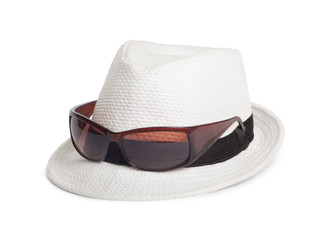 Sunglasses and a white summer hat on an isolated background