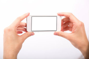 Hand and Smartphone on White Background