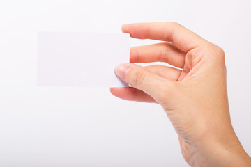 Obraz premium Female hand holding blank card isolated
