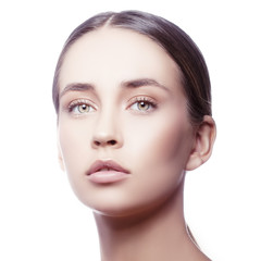 Fototapeta premium Young Girl beauty face over white background