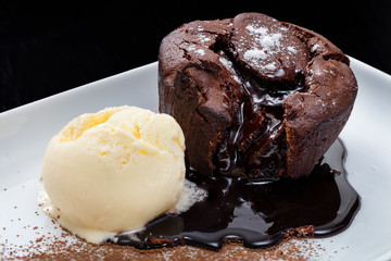 Close-up of chocolate lava cake with vanilla ice cream in a plate