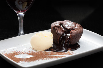 Chocolate lava cake with vanilla ice cream in a plate
