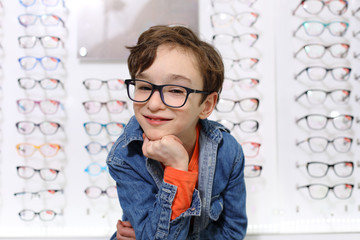 boy in glasses , at optics store     © wip-studio