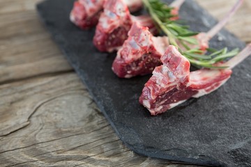 Rib chops and rosemary herb on slate board