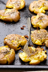 Baked potato with herbs .selective focus