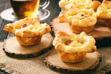 Appetizer -mini pies with mashed potatoes, bacon and cheese.