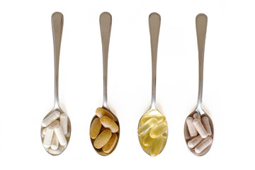Healthy supplements on teaspoons