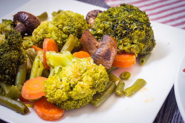 Baked vegetables. Broccoli, carrots, green beans, mushrooms