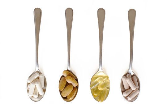 Healthy supplements on teaspoons