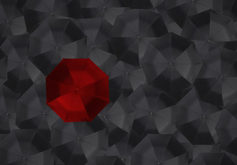 Red umbrella and many black umbrellas. business leader different concept.