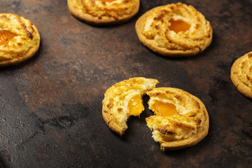 Cookies with a stuffing from jam on a dark metallic background 