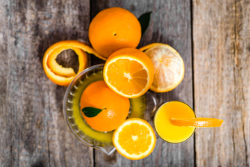 Squeezed orange juice and fresh oranges fruits, top view, flat lay