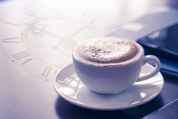 Double exposure of coffee cup with clock face