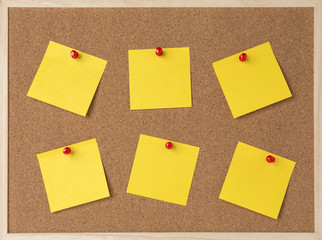 lot a yellow stickry note on wooden frame cork board.