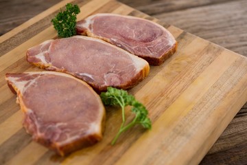 Blade chop and coriander leaves on wooden tray