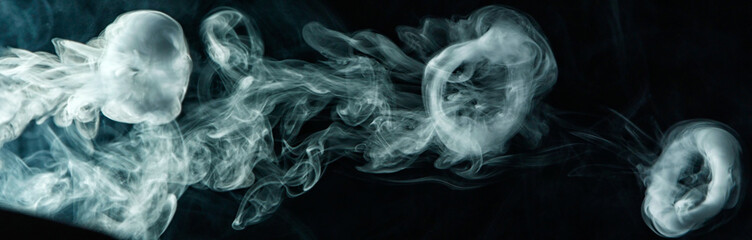 Vape trick smoke ring on dark background