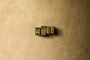 ROLL - close-up of grungy vintage typeset word on metal backdrop. Royalty free stock illustration.  Can be used for online banner ads and direct mail.