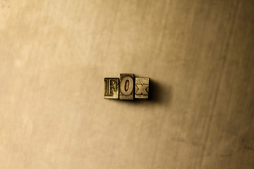 FOX - close-up of grungy vintage typeset word on metal backdrop. Royalty free stock illustration.  Can be used for online banner ads and direct mail.