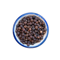 Black pepper in bowl on white. This has clipping path.