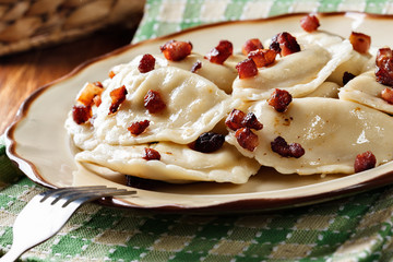 Dumplings with meat or cabbage and mushroom or cheese seasoned fried bacon