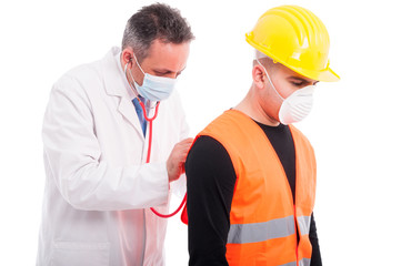 Doctor checking constructors lungs with stethoscope