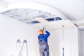 Installation of suspended ceilings. Finishing works - obrazy, fototapety, plakaty