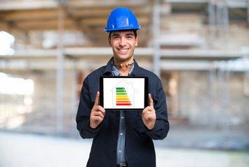 Architerct showing an energy efficiency scale on a tablet