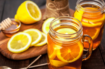 Hot tea with lemon and natural honey, good treat to have vitamins and strong immunity.