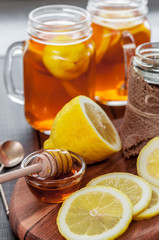 Hot tea with lemon and natural honey, good treat to have vitamins and strong immunity.