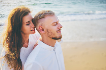 Fototapeta premium Young loving couple on the sea beach.