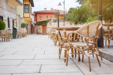 Cafe with wooden table in old town.