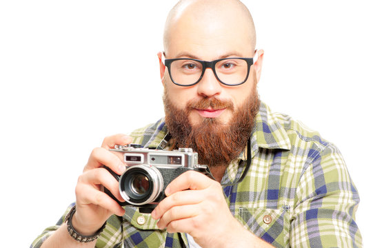 bearded man holding old-fashioned camera