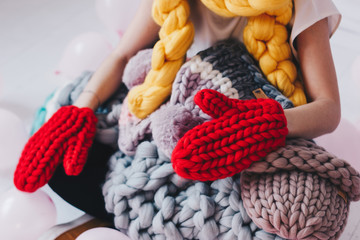 Knitted merino wool red mittens