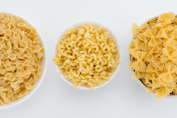 Raw italian macaroni in plates