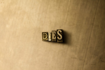 DIES - close-up of grungy vintage typeset word on metal backdrop. Royalty free stock illustration.  Can be used for online banner ads and direct mail.