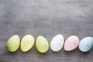 Easter eggs painted in colors on a pattern background.