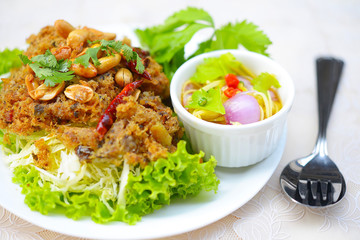 Crispy catfish salad with green mango and vegetable
