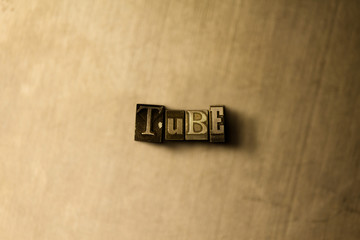 TUBE - close-up of grungy vintage typeset word on metal backdrop. Royalty free stock illustration.  Can be used for online banner ads and direct mail.