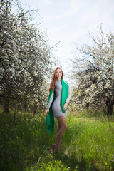 Naklejka na ściany i meble Beautiful smiling Woman Fashion Model with Apple Tree Flowers