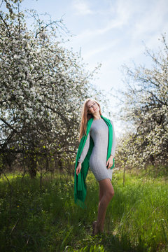 Beautiful Woman Fashion Model with Apple Tree Flowers