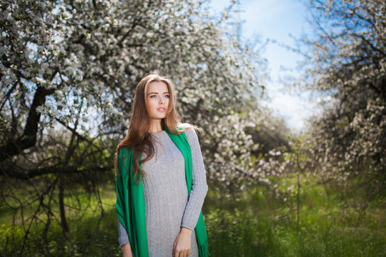 Beautiful Woman Fashion Model with Apple Tree Flowers