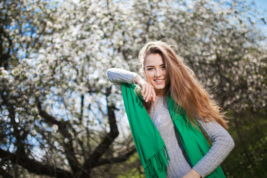 Beautiful smiling Woman Fashion Model with Apple Tree Flowers