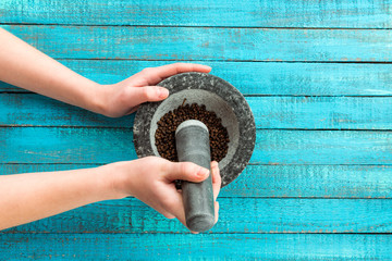 mortar and pestle in hands