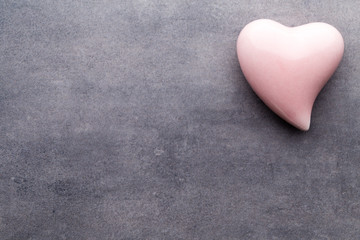 Fototapeta premium Colored heart on the gray background.