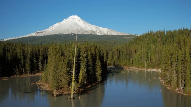 Mt Hood Aerial v18 Flying low over Trillium Lake towards full mountain views.